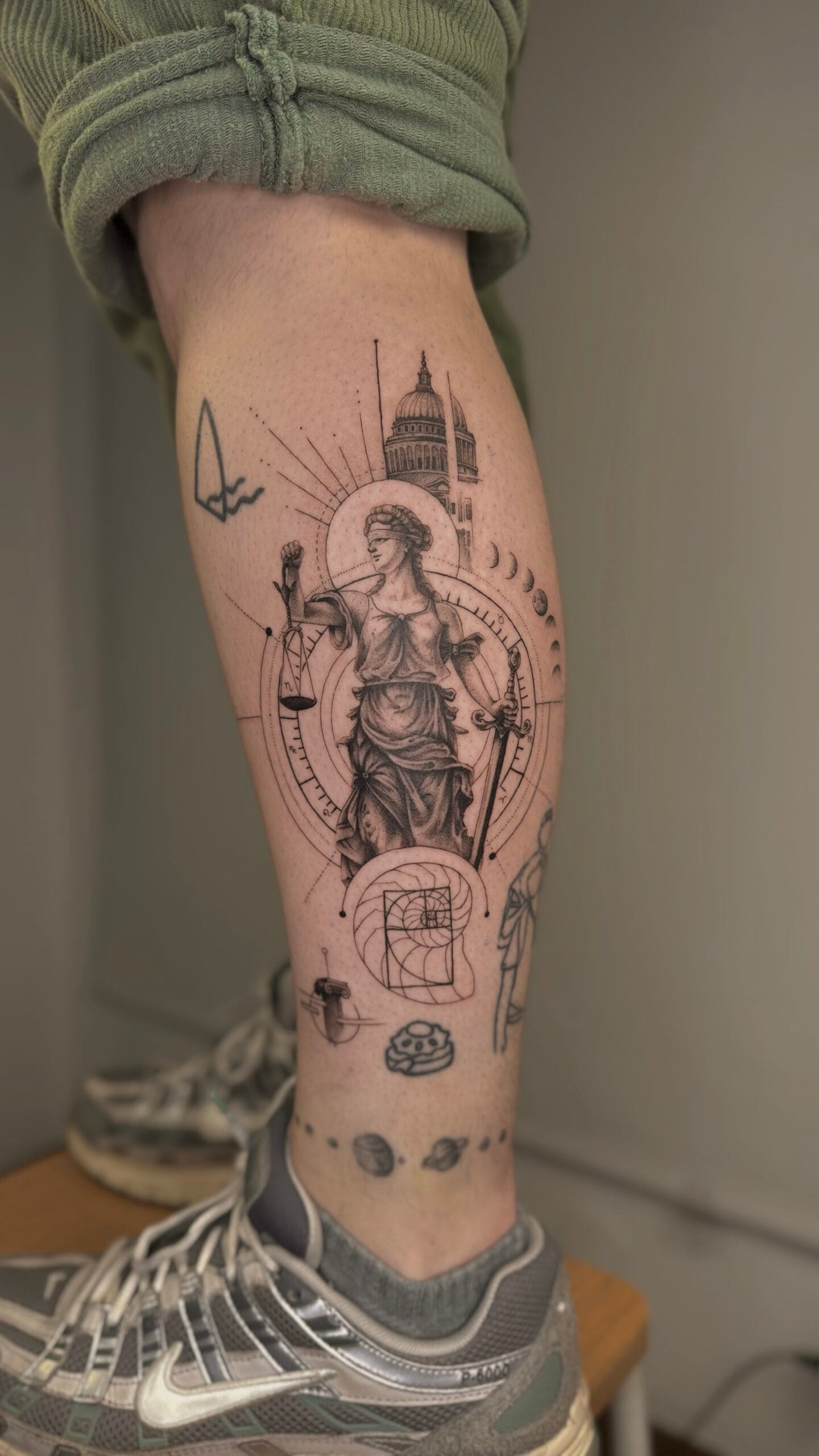Minimalist sun and moon tattoo on forearm in Porto Portugal by KORKACH Kateryna, fine line design