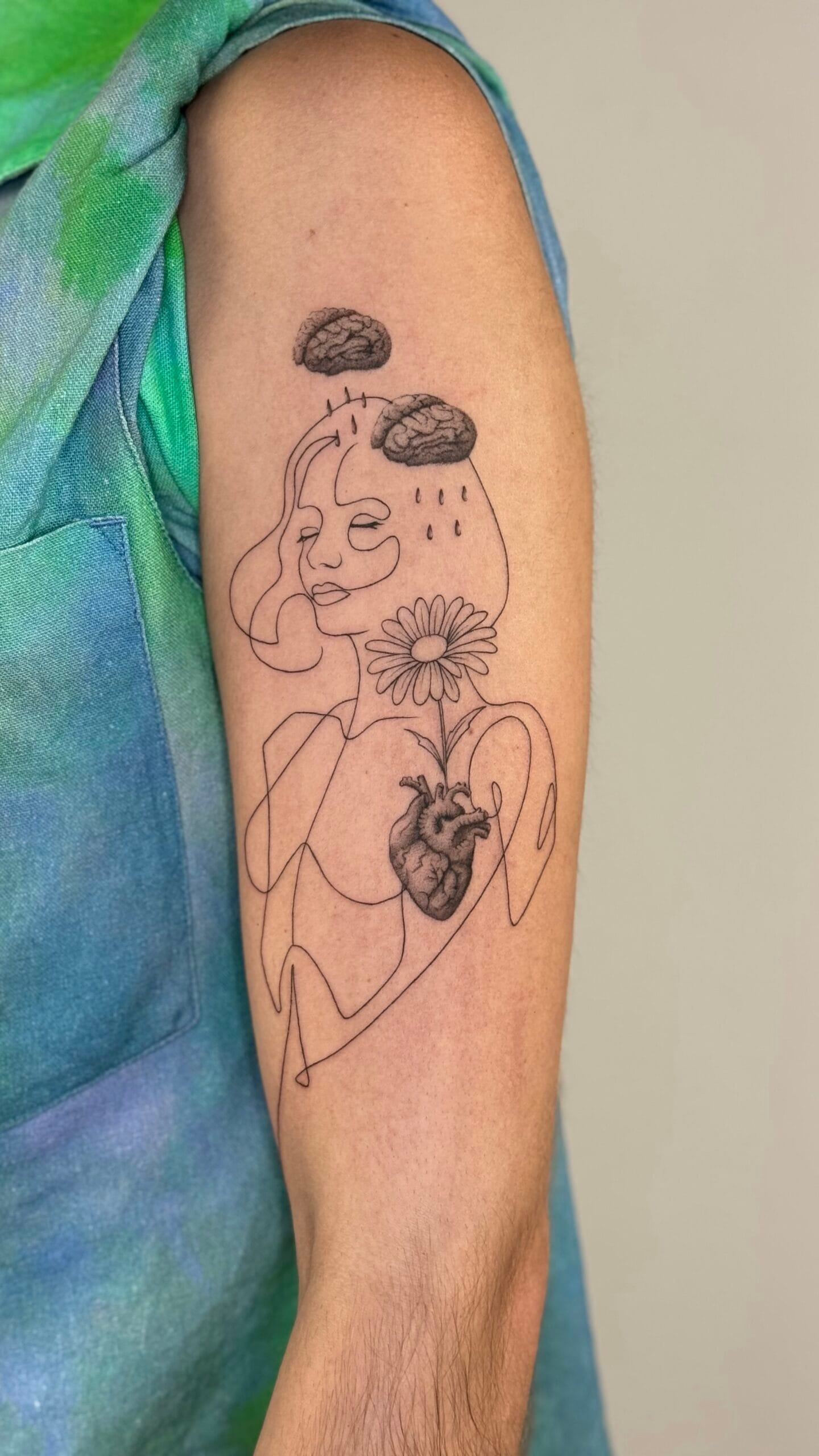 Watercolor fish tattoo with flowers on leg, colorful koi style tattoo Porto