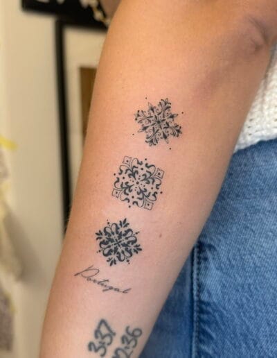 Small azulejo tile tattoos on arm, Portuguese fine line ornamental tattoos Porto