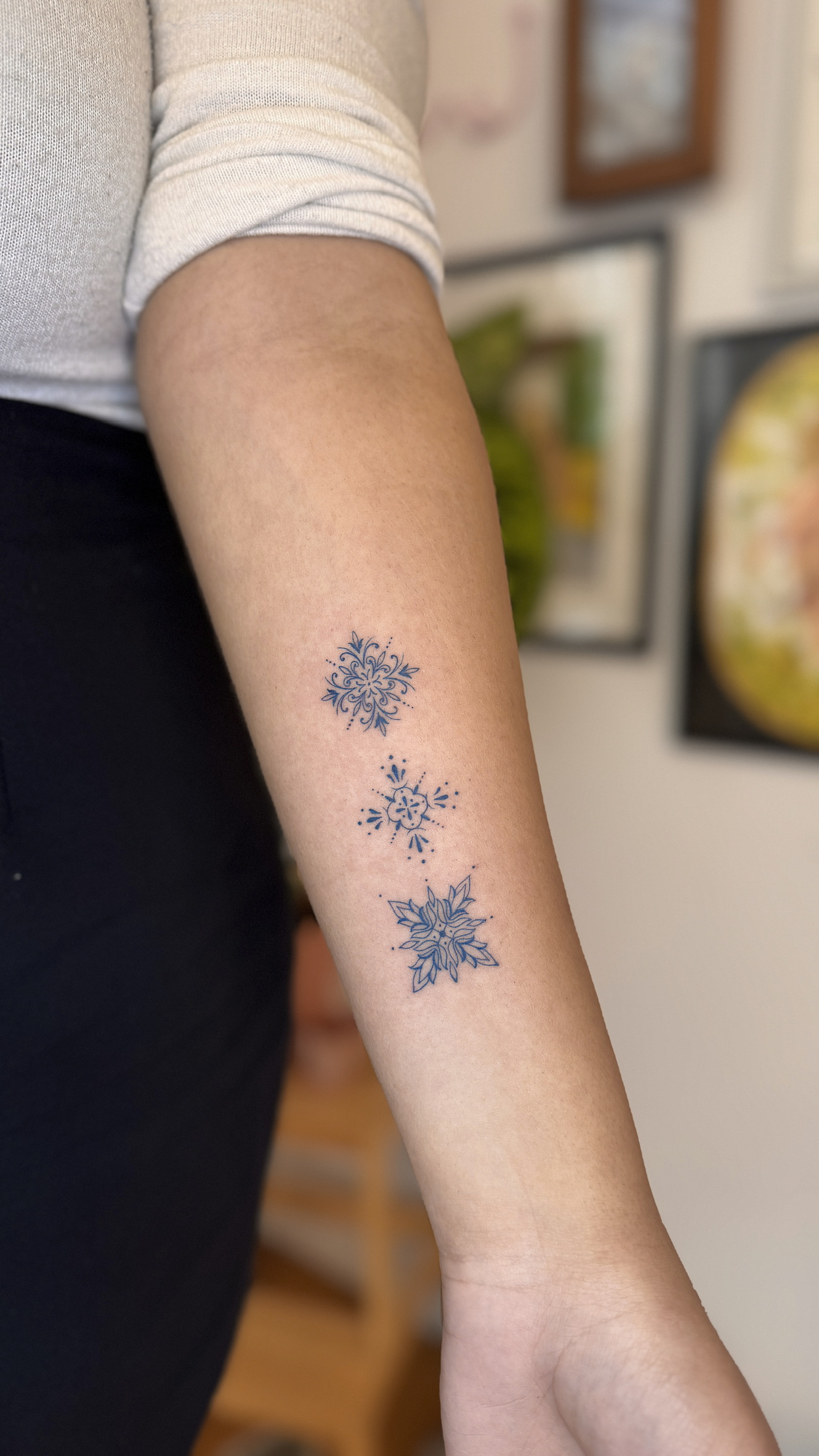 Small azulejo tile tattoos on forearm, Portuguese ceramic pattern fine line tattoo Porto