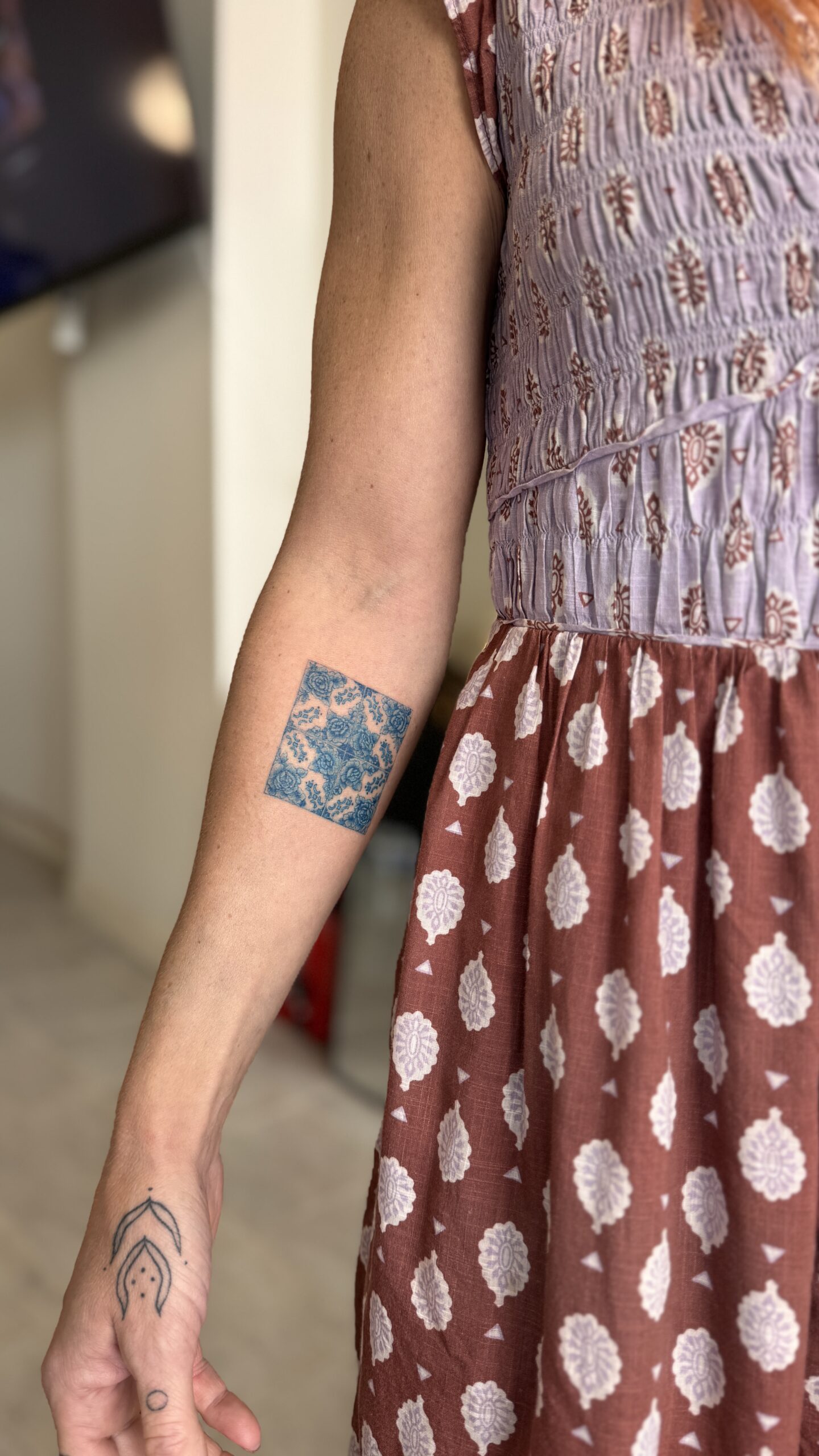 Custom azulejo tattoo on the forearm in Porto – inspired by traditional Portuguese tiles