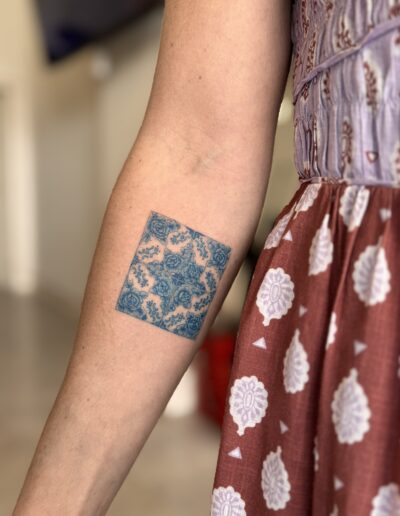 Blue azulejo tile tattoo on arm, Portuguese ceramic pattern tattoo Porto