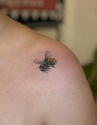 Micro realism bee tattoo on shoulder in fine detail, small realistic bee tattoo Porto