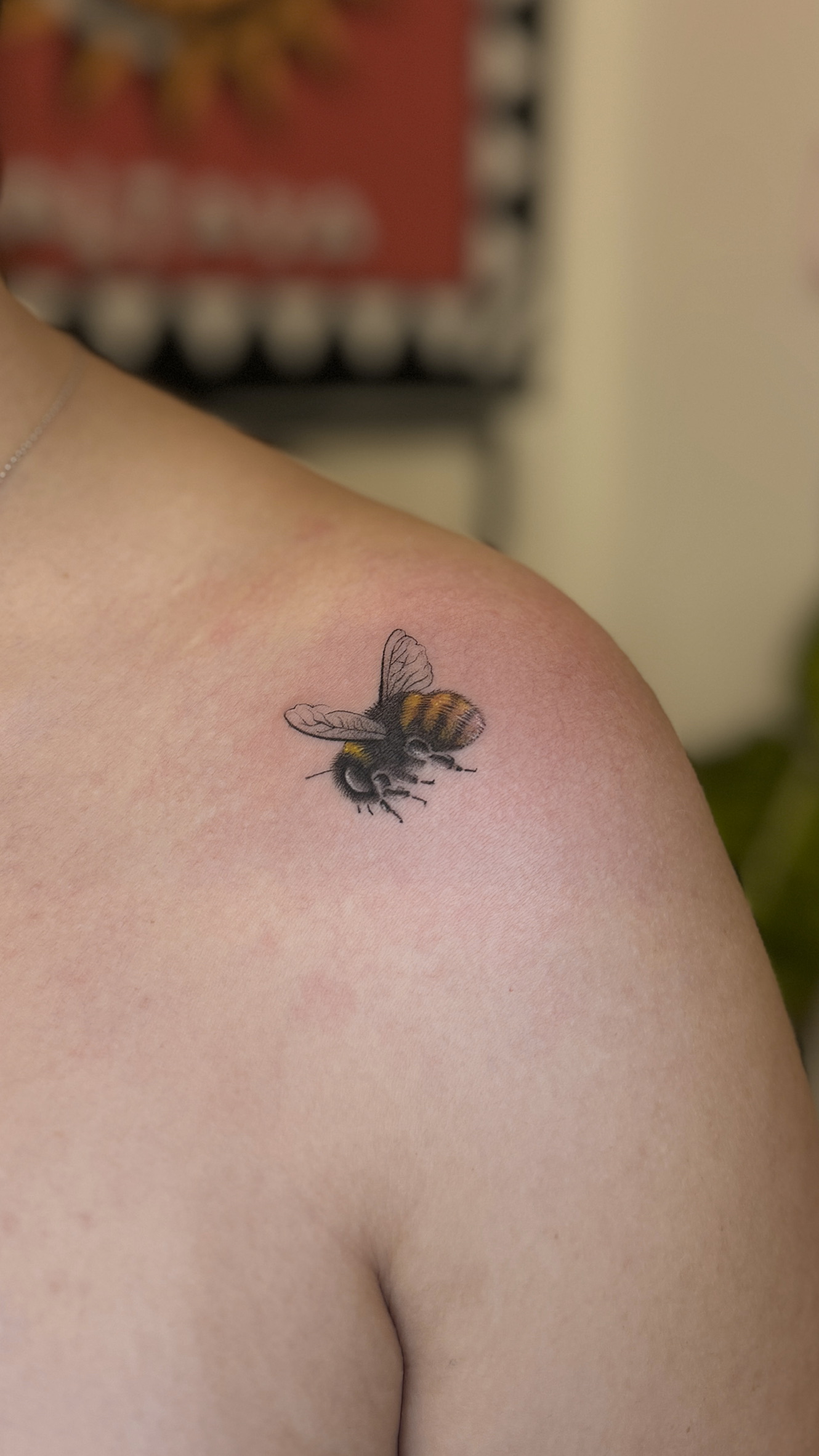 Micro realism bee tattoo on shoulder in fine detail, small realistic bee tattoo Porto