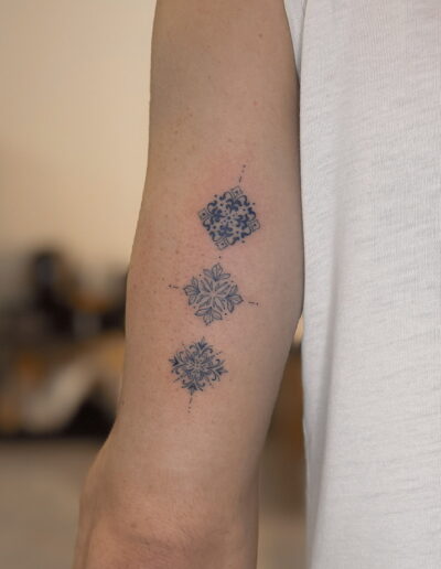Small azulejo tile tattoo on arm, Portuguese tile fine line tattoo Porto