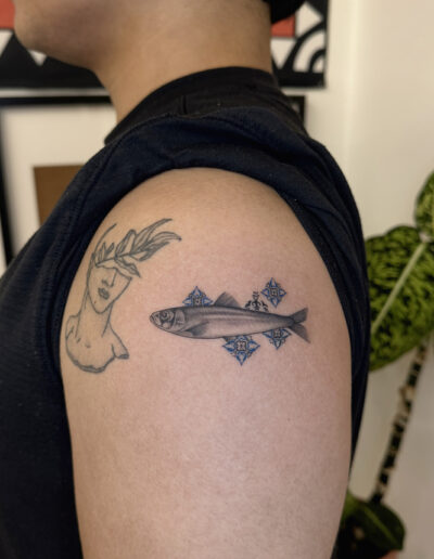 Realistic sardine tattoo on shoulder with azulejo tile pattern, Portuguese tattoo Porto