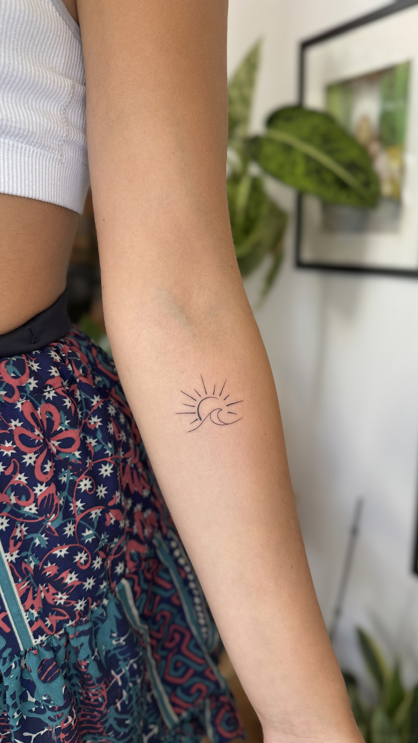 Minimalist sun and moon tattoo on forearm in Porto Portugal by KORKACH Kateryna, fine line design