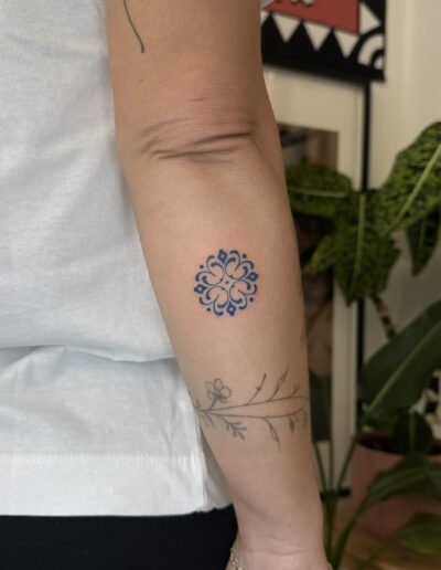 Small color azulejo tattoo on arm in Porto Portugal by KORKACH Kateryna, Portuguese tile design