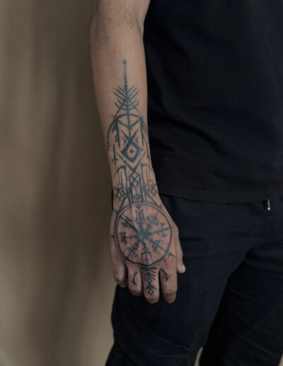 Geometric ornamental tattoo on hand and forearm in Porto Portugal by KORKACH Kateryna, fine line blackwork design