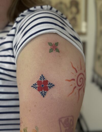 Color azulejo tile tattoo on arm in Porto Portugal by KORKACH Kateryna, Portuguese ornamental design