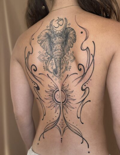 Fine line ornamental back tattoo around elephant on back in Porto Portugal by KORKACH Kateryna, decorative design