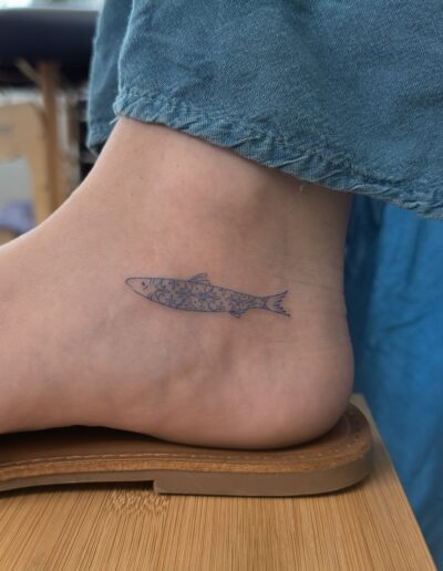 Fine line sardine tattoo on ankle in Porto Portugal by KORKACH Kateryna, Portuguese azulejo pattern