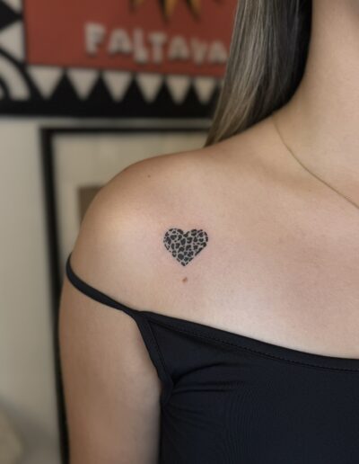Fine line ornamental heart tattoo on shoulder in Porto Portugal by KORKACH Kateryna, patterned design